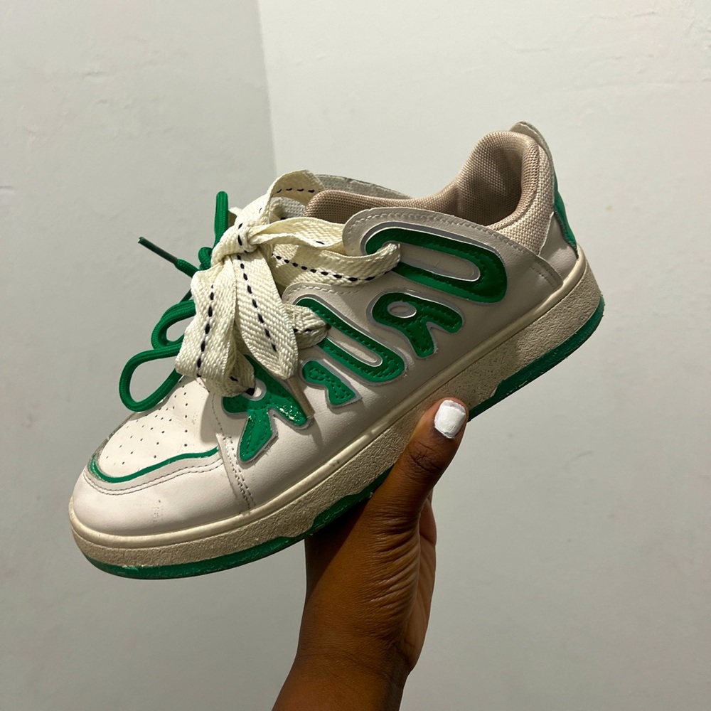 Originals white and green trainers.